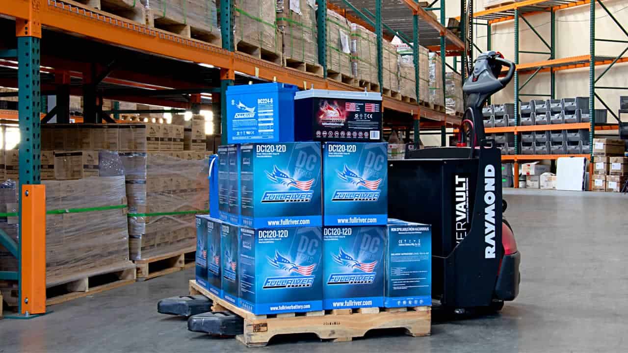 Electric pallet jack carrying a pallet with Fullriver DC series and a single Full Throttle battery.