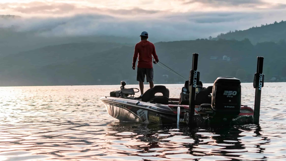 Bass fishing boat on the water at sunset